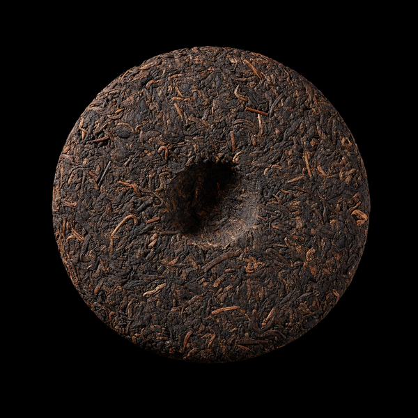 Ripe Shu Pu-erh Cake on bold black background — sticker energy product photography